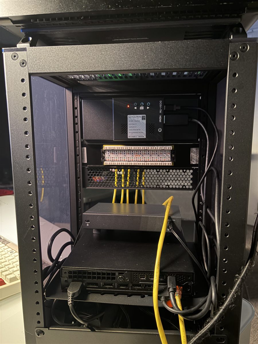 Rear of the rack showing the punched-down patch panel and cable runs