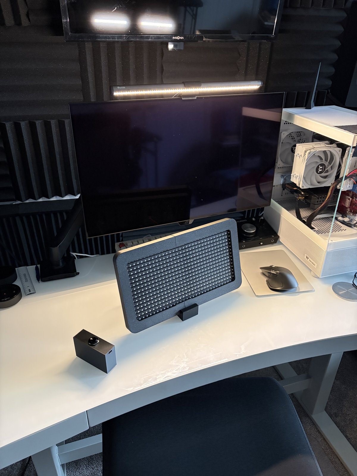 The finished scoreboard on a desk next to a player button